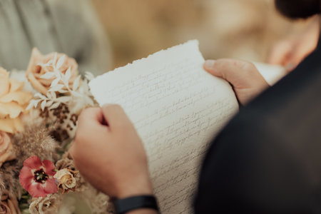 The groom reads the vows to his wifeの写真素材