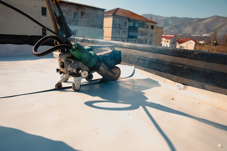 Waterproofing and insulation at construction site, waterproofing membrane preventing water penetration. Exterior vapor barrier for roof.の写真素材