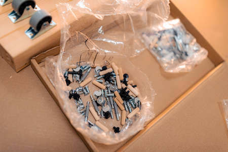 Bolts, furniture wheels and accessories for assembling furniture wooden parts