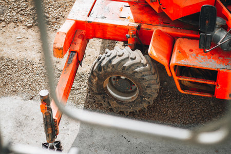 wheel of the machine is an integral part of the lifting mechanism, working in tandem with the supporting arm to raise heavy loads.の写真素材
