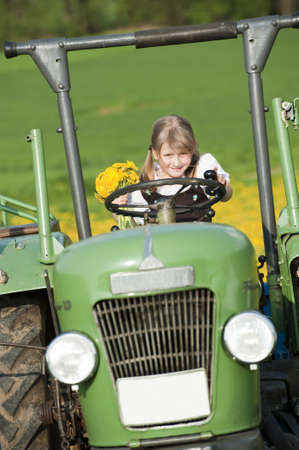 Little girl on a tractorの写真素材