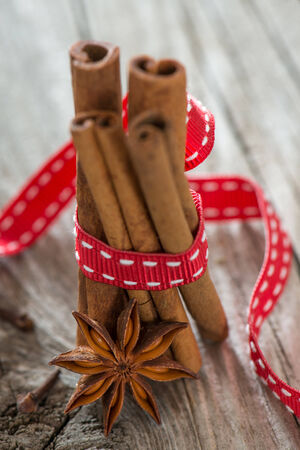 Christmas spices on wooden backgroundの写真素材