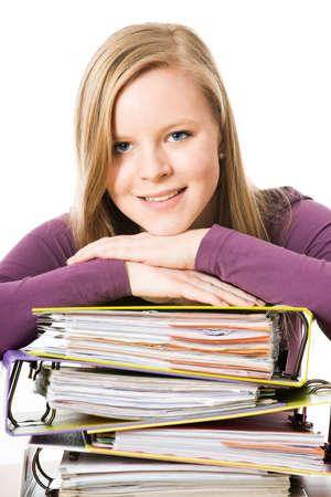 Schoolgirl with books isolated on whiteの写真素材