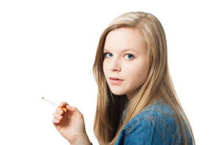 Teenage girl with cigarette isolated on whiteの写真素材