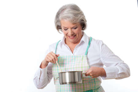 Housewife with saucepan and wooden spoonの写真素材