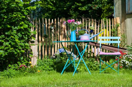 Idyllic garden with table and chair