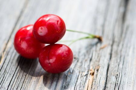 Cherries on a wooden background