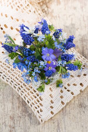 Spring flower bouquet in a coffee cupの写真素材