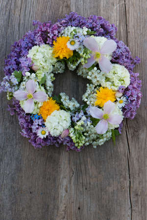 Spring flower wreath on wooden