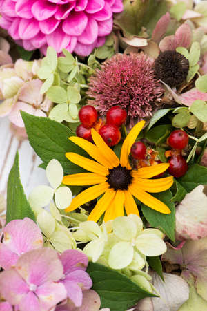 Colorful autumn wreath in a gardenの写真素材