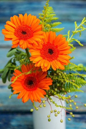 Gerbera flower bouquet on a garden tableの写真素材