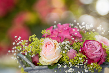 Loving bouquet of pink roses and hydrangea blossomの写真素材