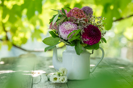 Romantic bouquet on a wooden table with nature backgroundの写真素材
