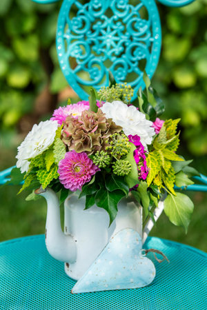 Flower bouquet in an old enamel potの写真素材