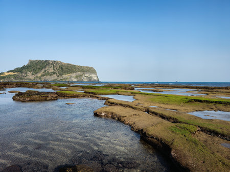 Scenic view of the sea and rocks on the coast of the islandの写真素材