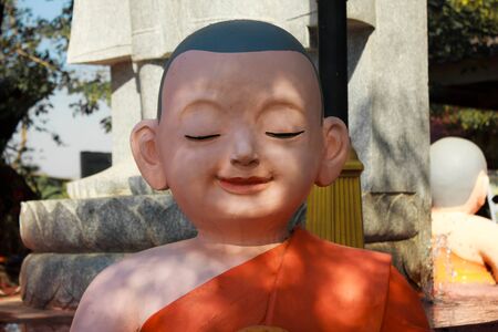 Earthenware of child monk in summer dayの写真素材