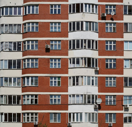 Big house, city life, windows and balconiesの写真素材