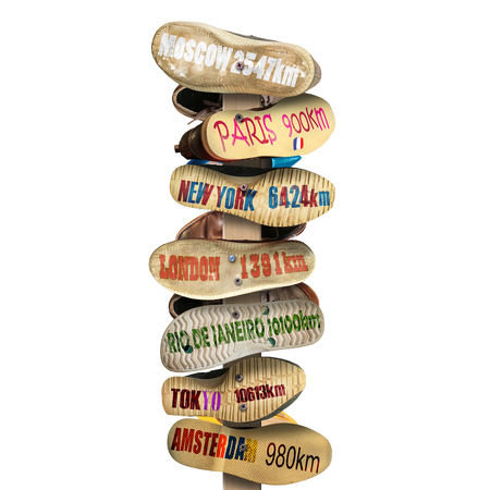 Signpost is made of old worn shoes, the distance to the citiesの写真素材