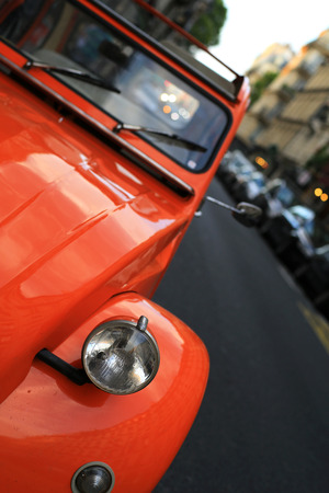 Retro car orange color purity in the streetの写真素材