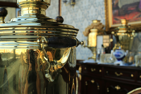 Old copper teapot, a samovar and bagels, biscuitsの写真素材