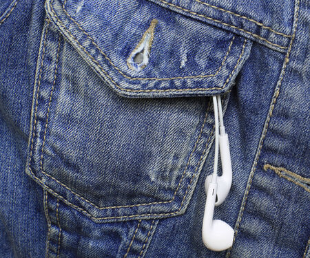 Pocket blue denim jacket with headphones, fabricの写真素材