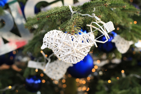 Christmas toy on the Christmas tree, white wicker birdの写真素材