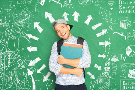 Student with a backpack near the school boardsの写真素材