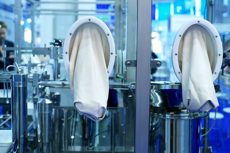 Sterile plant for the production of medicines with rubber glovesの写真素材