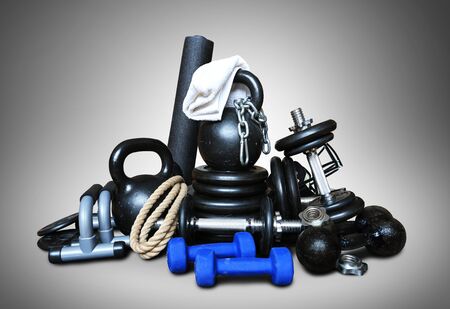 Sports equipment for bodybuilding collected in a heapの写真素材