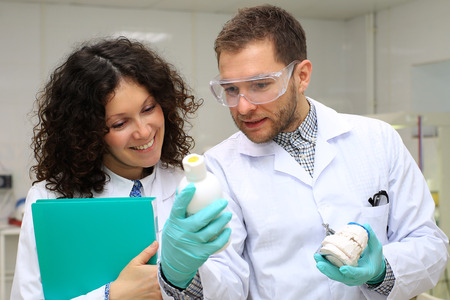 Dental technicians discuss the work in the laboratory