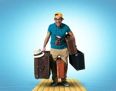 Tourist on vacation with a bunch of old suitcases