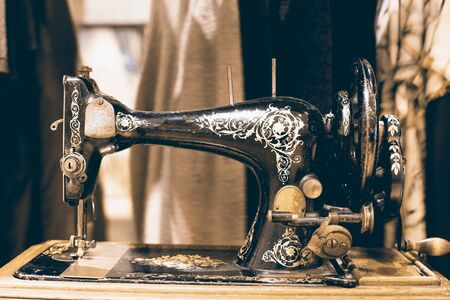 Black retro sewing machine in an old house