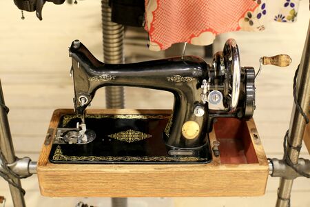 Black retro sewing machine in an old house
