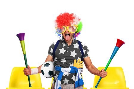 Football fan in a coloured wig and big glassesの写真素材