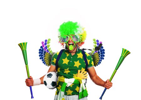 Brazil football fan in a green wig and hornsの写真素材