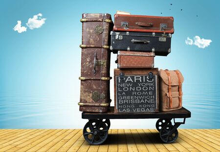 Luggage tourists with big suitcases on a cartの写真素材