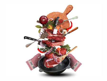 Meat and beef meatballs with vegetables and utensilsの写真素材