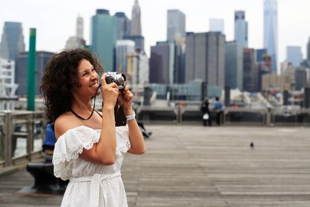 Young beautiful woman photographing in new Yorkの写真素材