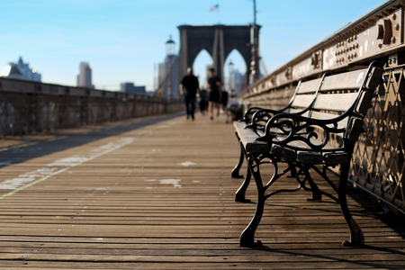 Wooden bench on the Brooklyn bridge in new Yorkの写真素材