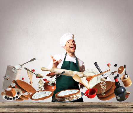 Cooking a large cake with berries and cream fillingの写真素材