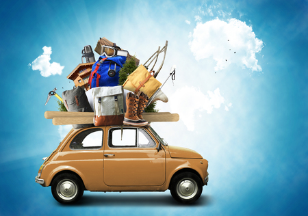 Adventure and tourism, small car with tourist equipmentの写真素材