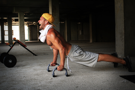 Guy in the baseball cap in the gymの写真素材