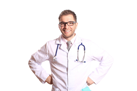 Doctor writes a patient a prescription in medical officeの写真素材