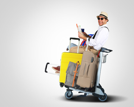 Luggage tourists with big suitcases on a cartの写真素材