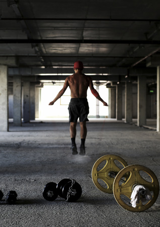 Athlete is engaged in crossfit in the gymの写真素材