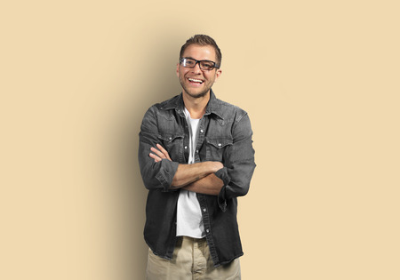Young man in denim shirt is smilingの写真素材