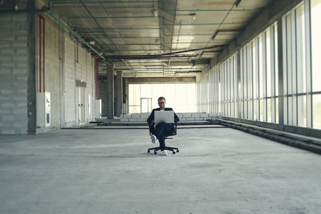 Young businessman with laptop