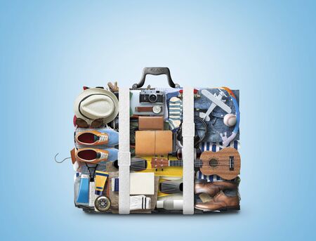 Travel suitcase consisting of items and clothing for vacation, travel conceptの写真素材
