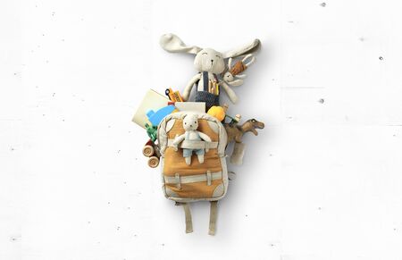 Cute children's backpack with a variety of toys, the concept of childhood