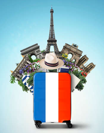 France, modern suitcase with French flag and landmarksの写真素材